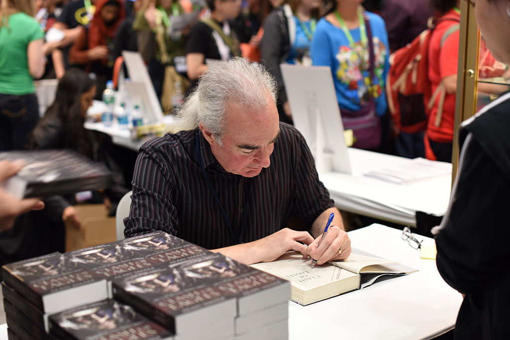 Alan signing books
