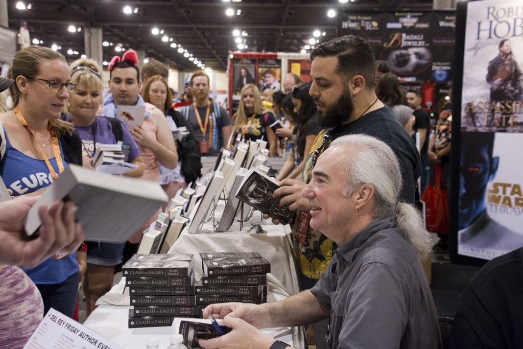 Alan signing books
