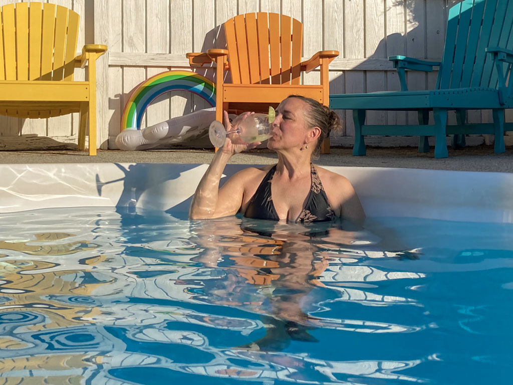 Karen drinking in the pool